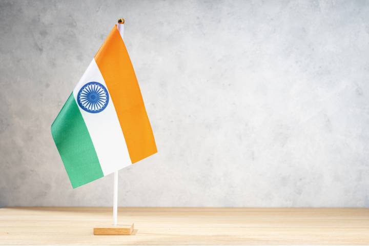 india-table-flag-on-white-textured-wall-2021-09-24-23-58-53-utc.jpg